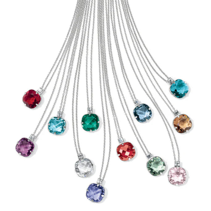 Colorful gemstone necklaces on a white background with text about the rainbow theme.