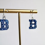 Acrylic Bedford Blue Glitter “B” Earrings - Juli's Wearable Art