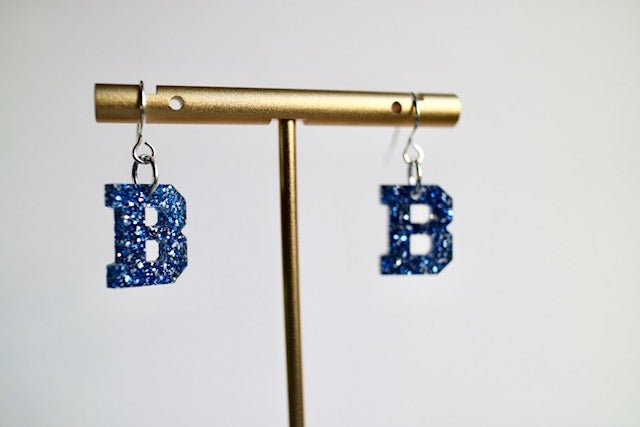Acrylic Bedford Blue Glitter “B” Earrings - Juli's Wearable Art