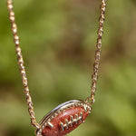 Kendra Scott Football Short Pendant Necklace in Orange Goldstone - Juli's Wearable Art